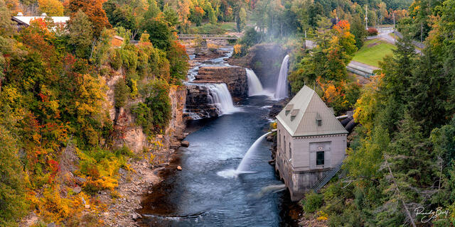 Ausable Chasm with fall color and a waterfall.