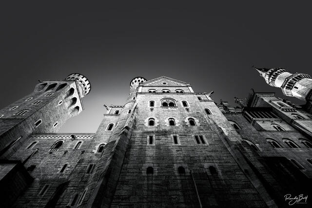 black and white photograph of the Neuschwanstien Castle looking towards the sky