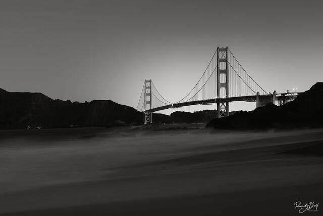 black and white golden gate bridge at sunrise.