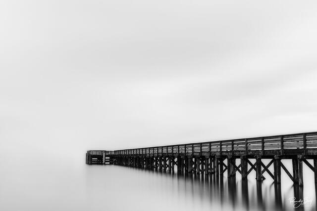 black and white, long exposure image of the dock at Bowman Bay at Deception Pass, Washington