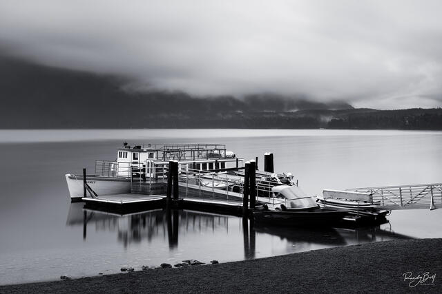 long exposure of lake McDonald lodge tour boats.