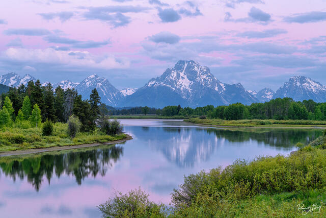 sunrise and alpen glow over mount Moran from Oxbow Bend in Grand Teton National Park.