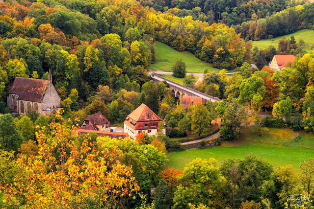 old homestead outside the Rothenburg walls with fall color leaves just starting.