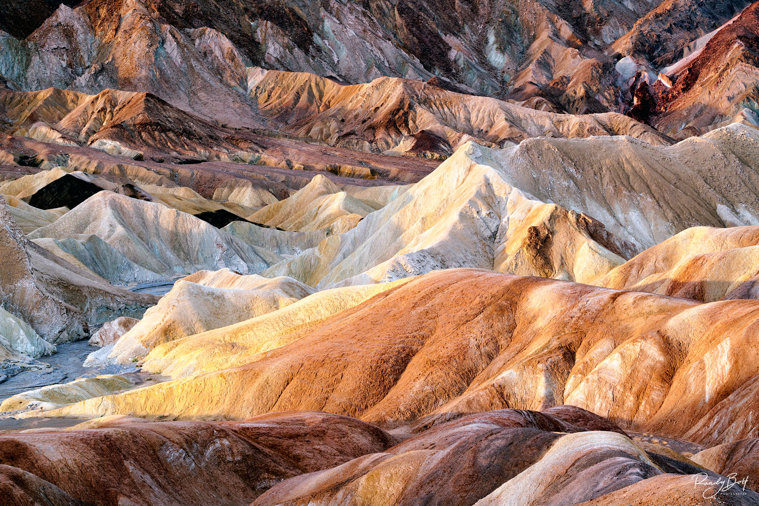 Zabriskie point colors at sunrise n Death Valley National Park