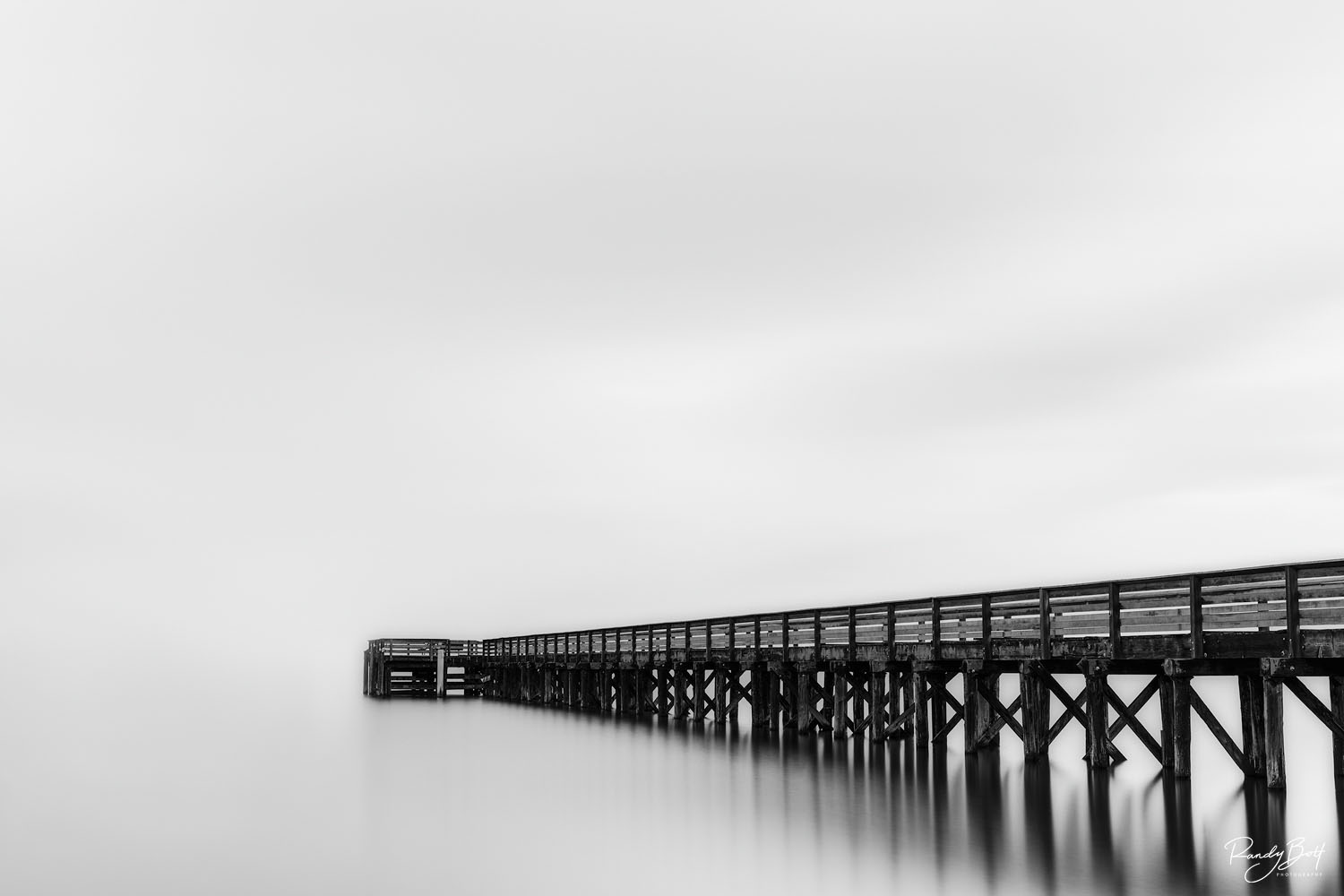 black and white, long exposure image of the dock at Bowman Bay at Deception Pass, Washington