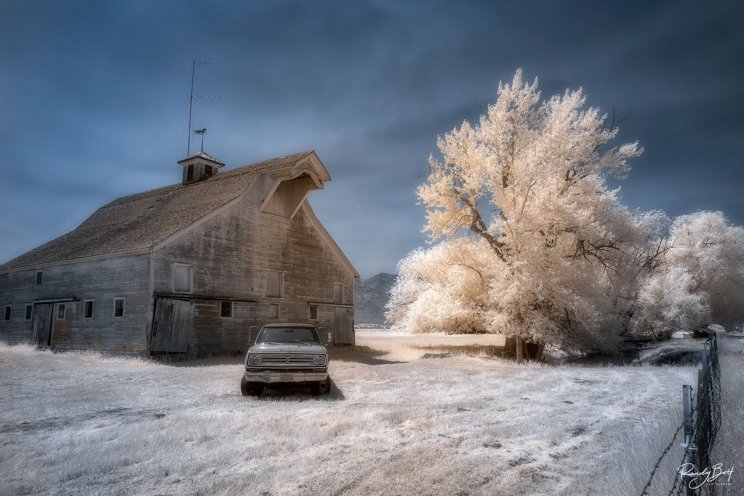 720 nm infrared photograph of an old barn and truck in Joseph, Oregon.