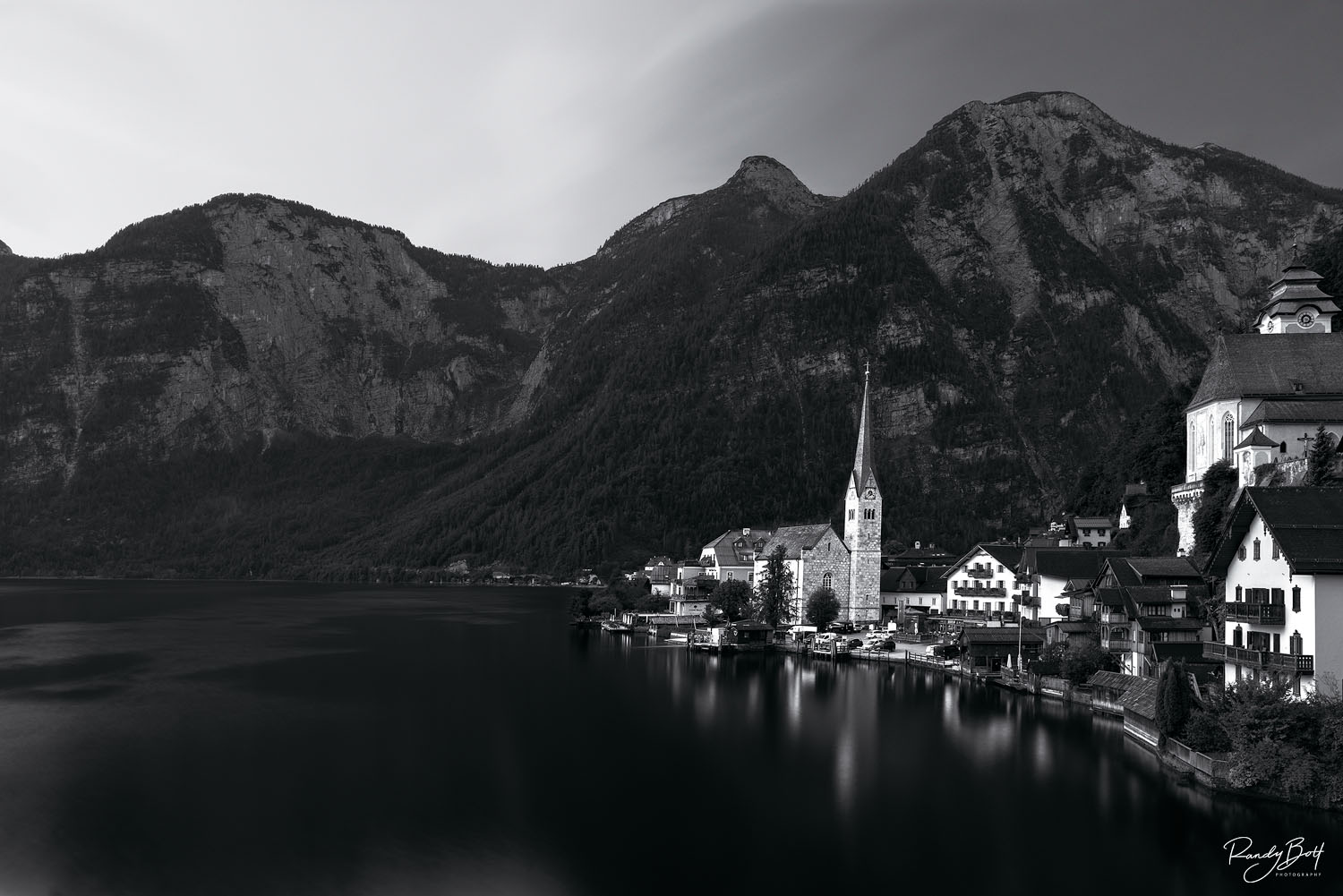 Morning Light black and white image of Hallstat, Austria during sunrise reflecting in Hallstat Lake