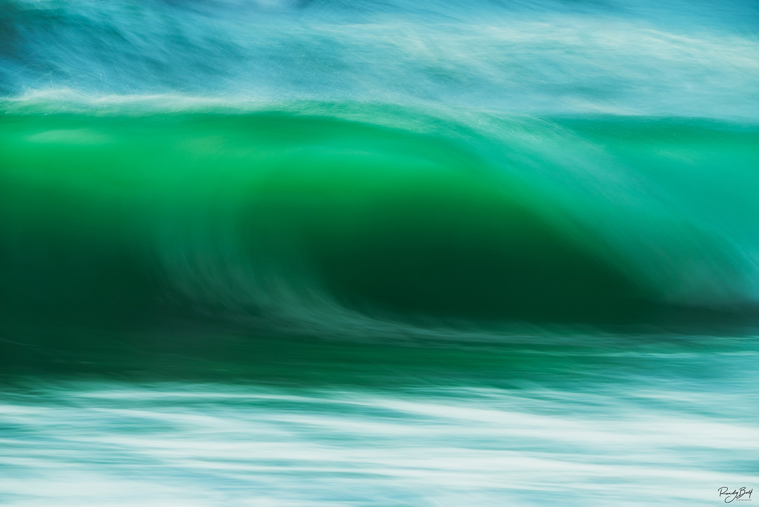 long exposure of a crashing wave on the beach in california.